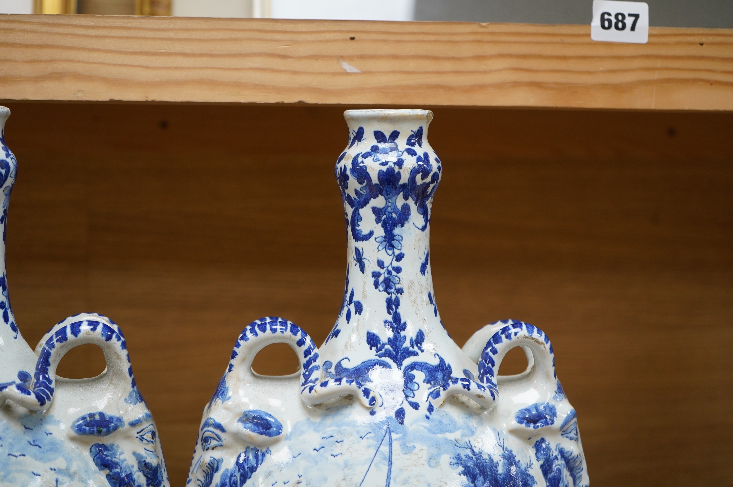 A pair of mid 18th century Delft blue and white flagons